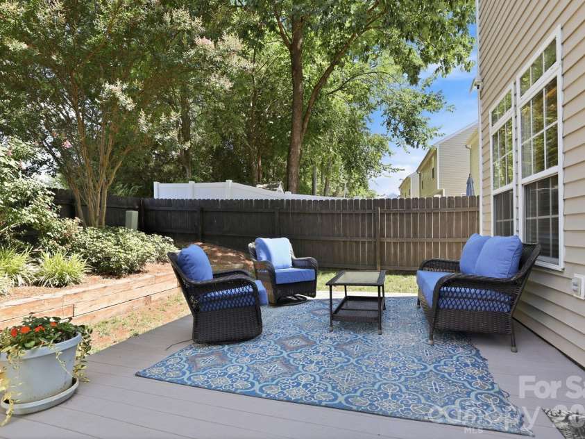 5304 Silabert Avenue, Charlotte, NC 28205.  MLS# CAR4398785, YatesRealty ID 34416. Private backyard retreat featuring a spacious composite deck—perfect for relaxing, grilling, or entertaining.