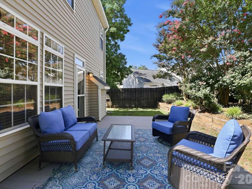5304 Silabert Avenue, Charlotte, NC 28205.  MLS# CAR4398785, YatesRealty ID 34416. Spacious low-maintenance composite deck overlooking the backyard, perfect for entertaining, grilling, or relaxing outdoors.