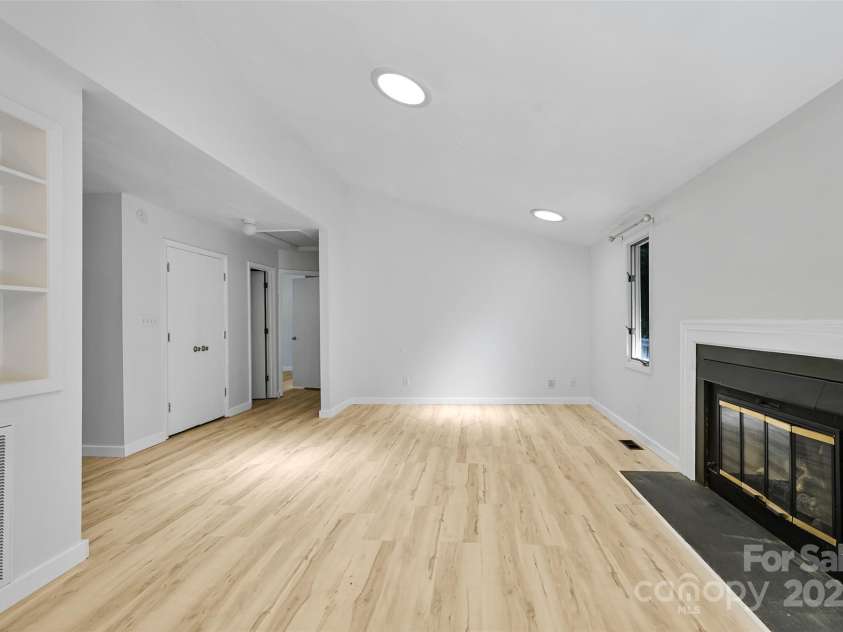 71 Hollybrook Drive, Asheville, NC 28803.  MLS# CAR4294339, YatesRealty ID 34419. Living room facing bedrooms