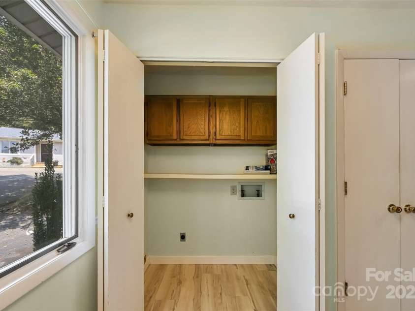 71 Hollybrook Drive, Asheville, NC 28803.  MLS# CAR4294339, YatesRealty ID 34419. Washer & Dryer in Kitchen