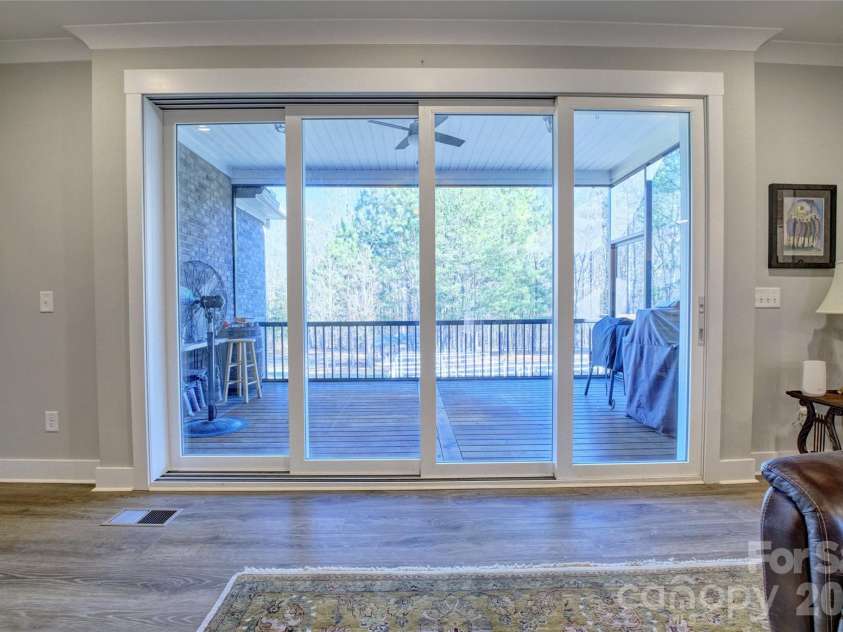 398 Kingsburry Road, Clover, SC 29710.  MLS# CAR4337912, YatesRealty ID 3443. Screened porch beside great room