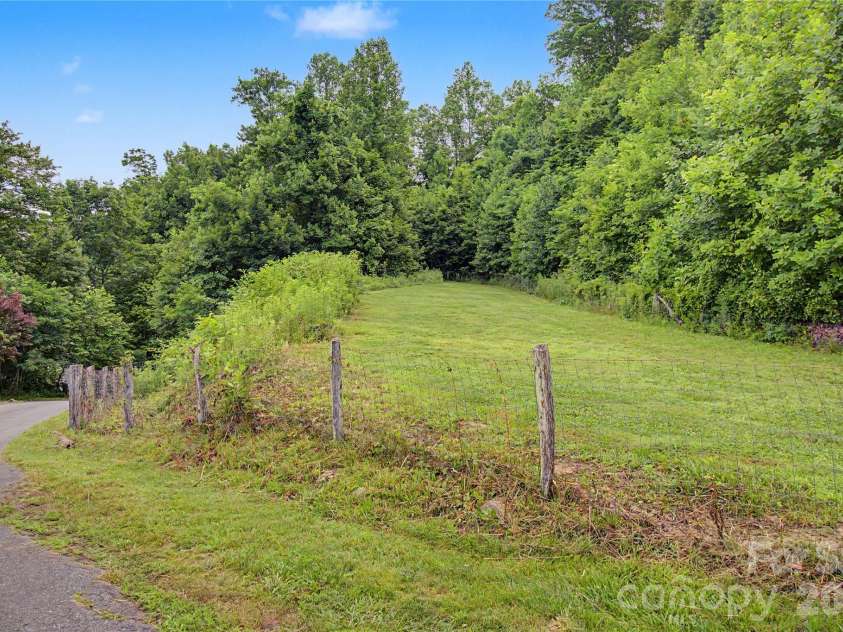 340 Earlys Mountain Road, Leicester, NC 28748.  MLS# CAR4398900, YatesRealty ID 34431. Large level area that gets full sunlight perfect for gardening.
