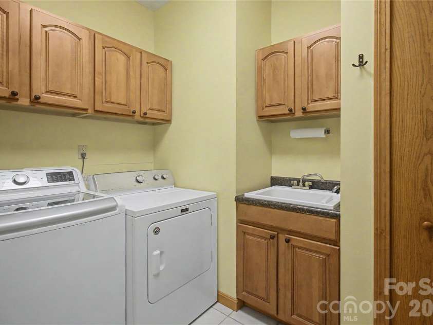340 Earlys Mountain Road, Leicester, NC 28748.  MLS# CAR4398900, YatesRealty ID 34431. Laundry Room off kitchen. (washer/dryer do not convey)