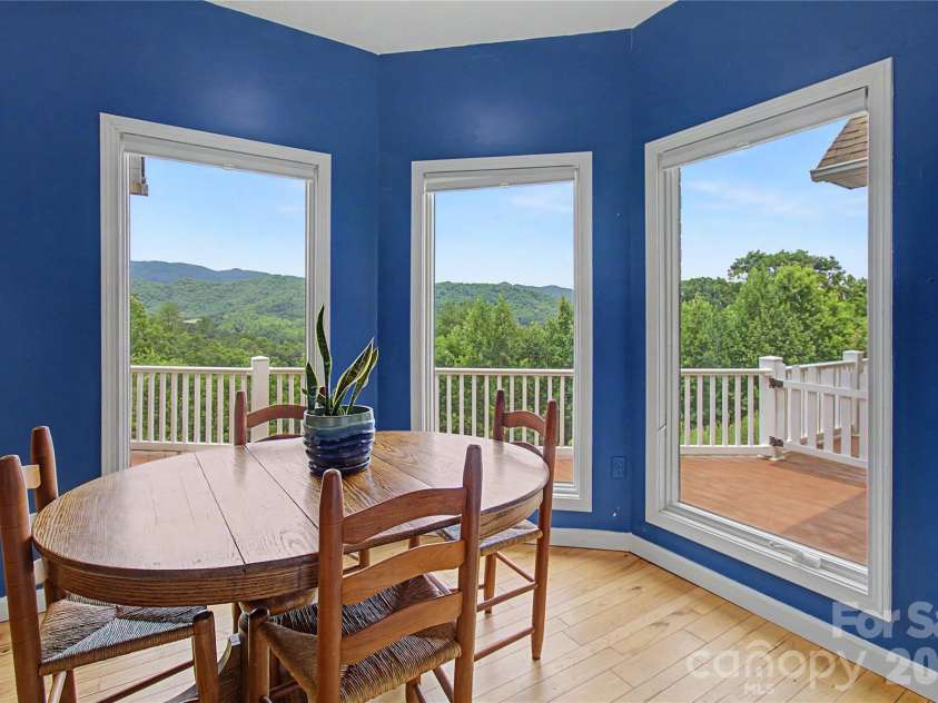 340 Earlys Mountain Road, Leicester, NC 28748.  MLS# CAR4398900, YatesRealty ID 34431. The sunny breakfast nook is the perfect place to enjoy your morning coffee, a quick snack, or simply relax while soaking in the amazing views.
