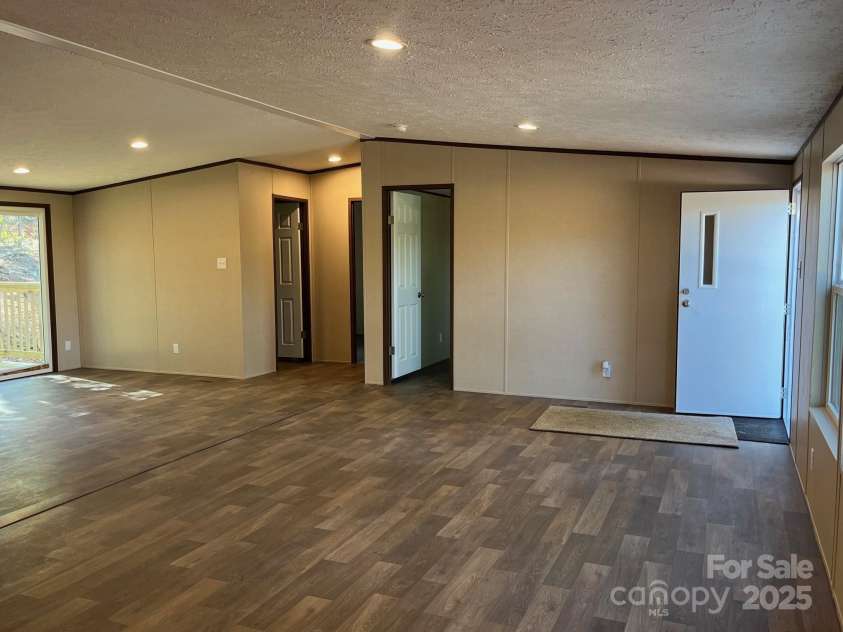 175 Shilah Lane Drive, Nebo, NC 28761.  MLS# CAR4289427, YatesRealty ID 34432. Living room 