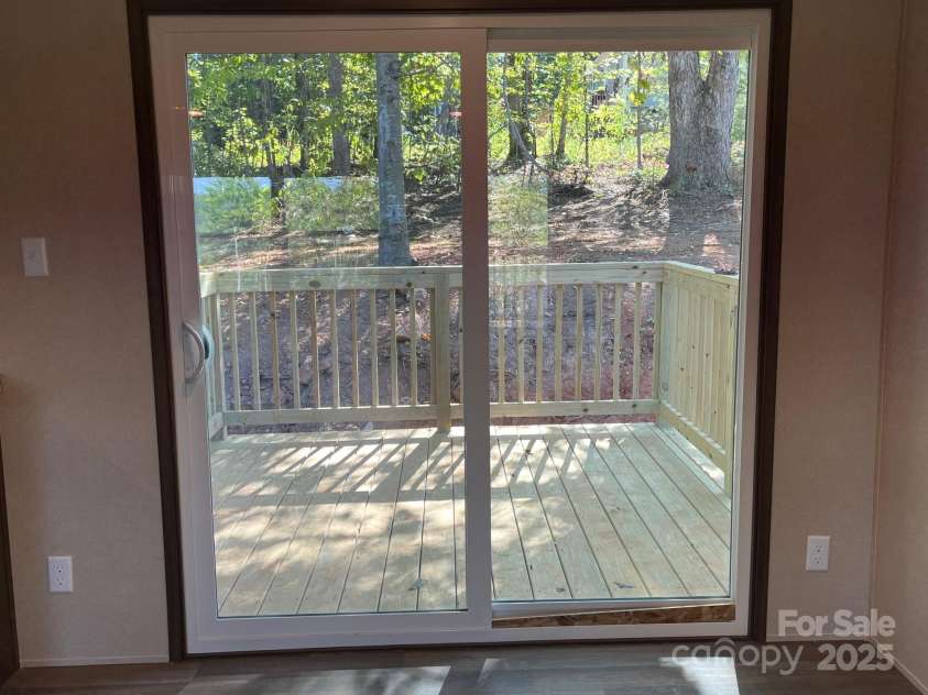 175 Shilah Lane Drive, Nebo, NC 28761.  MLS# CAR4289427, YatesRealty ID 34432. Sliding glass door to back porch 