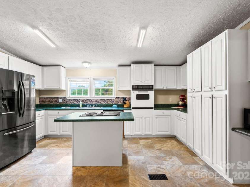 51 Farmstead Road, Leicester, NC 28748.  MLS# CAR4280263, YatesRealty ID 34438. Spacious kitchen.