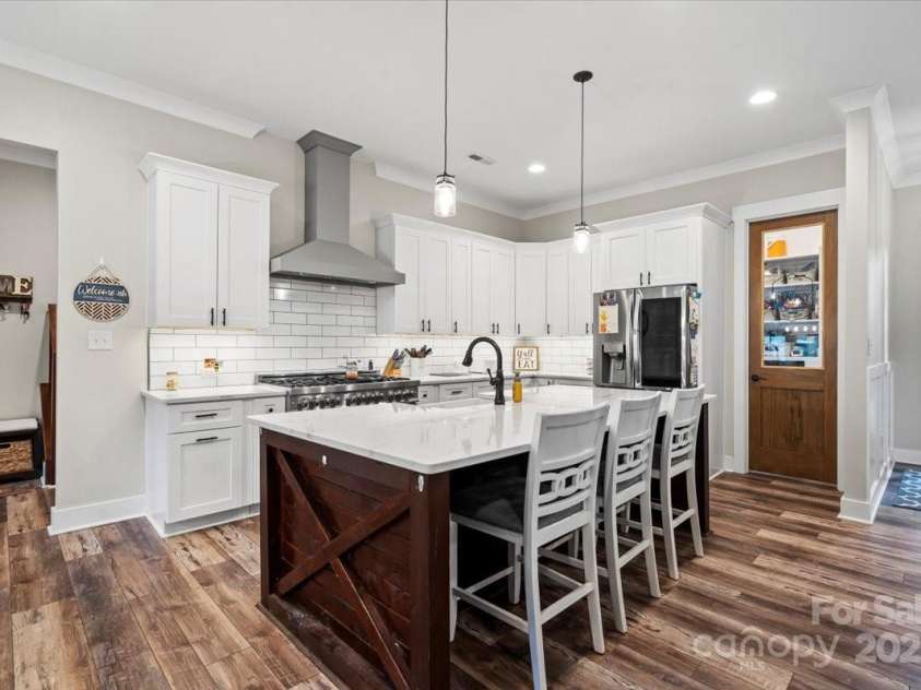 867 Bellegray Road, Clover, SC 29710.  MLS# CAR4262623, YatesRealty ID 34439. Large kitchen island - notice the Panty entry door!