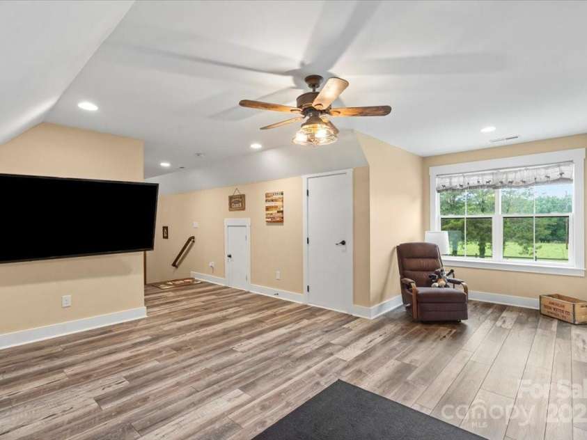 867 Bellegray Road, Clover, SC 29710.  MLS# CAR4262623, YatesRealty ID 34439. Upstairs game room with LVP flooring
