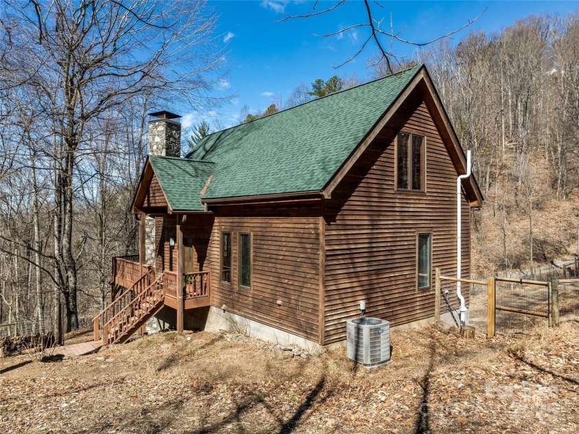 45 Wilderness Drive, Weaverville, NC 28787.  MLS# CAR4221623, YatesRealty ID 3444. Cedar-sided mountain chalet