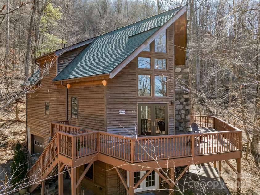 45 Wilderness Drive, Weaverville, NC 28787.  MLS# CAR4221623, YatesRealty ID 3444. Huge wraparound porch with patio below
