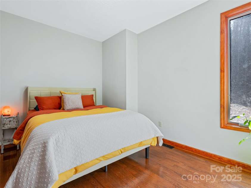 45 Wilderness Drive, Weaverville, NC 28787.  MLS# CAR4221623, YatesRealty ID 3444. Large window complements the space