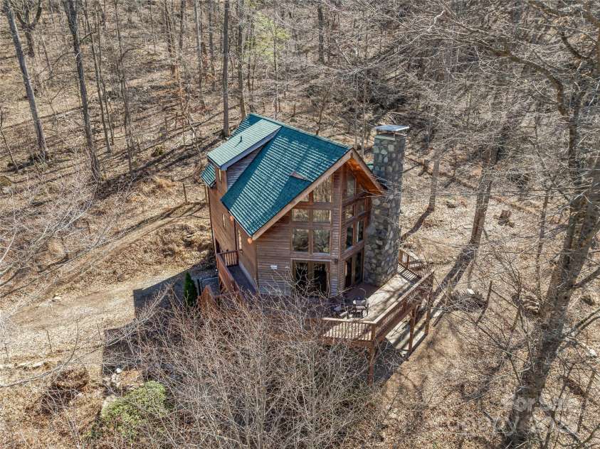 45 Wilderness Drive, Weaverville, NC 28787.  MLS# CAR4221623, YatesRealty ID 3444. Mountain home in the trees