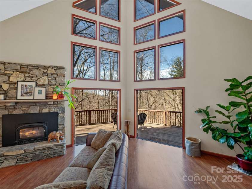 45 Wilderness Drive, Weaverville, NC 28787.  MLS# CAR4221623, YatesRealty ID 3444. Stunning great room opens up to wraparound deck