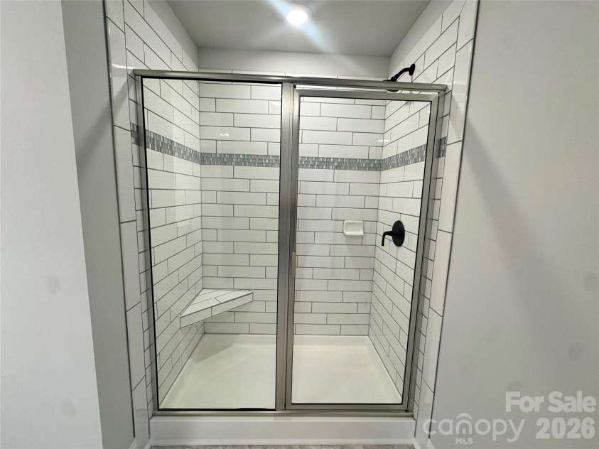 712 Inwood Hill Drive, Gastonia, NC 28056.  MLS# CAR4399206, YatesRealty ID 34440. Ceramic tiled shower  Representative Photo