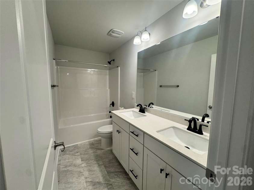 712 Inwood Hill Drive, Gastonia, NC 28056.  MLS# CAR4399206, YatesRealty ID 34440. Hall bathroom  Representative Photo