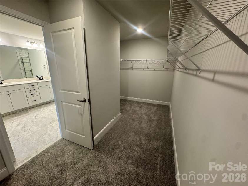 712 Inwood Hill Drive, Gastonia, NC 28056.  MLS# CAR4399206, YatesRealty ID 34440. Oversized walk-in closet  Representative Photo