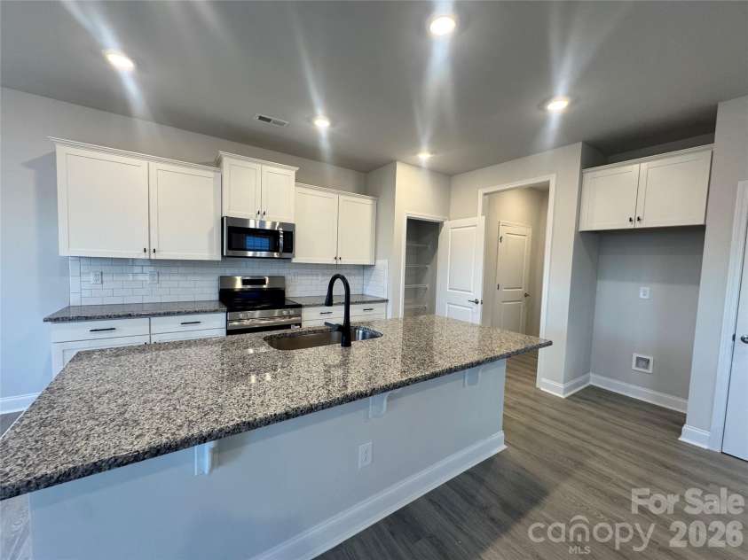 712 Inwood Hill Drive, Gastonia, NC 28056.  MLS# CAR4399206, YatesRealty ID 34440. Spacious kitchen island Representative Photo