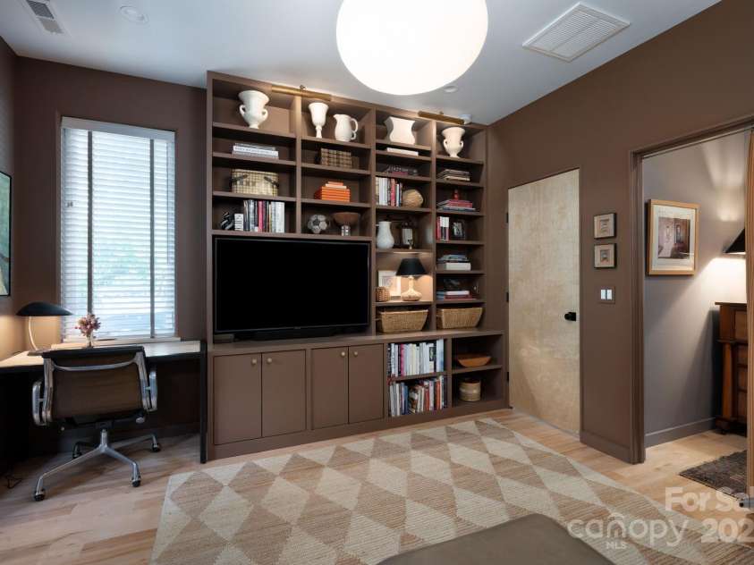 26 Winnfred Street, Asheville, NC 28806.  MLS# CAR4293290, YatesRealty ID 34446. Desk Nook and Floor-to-Ceiling Display/Book Shelves