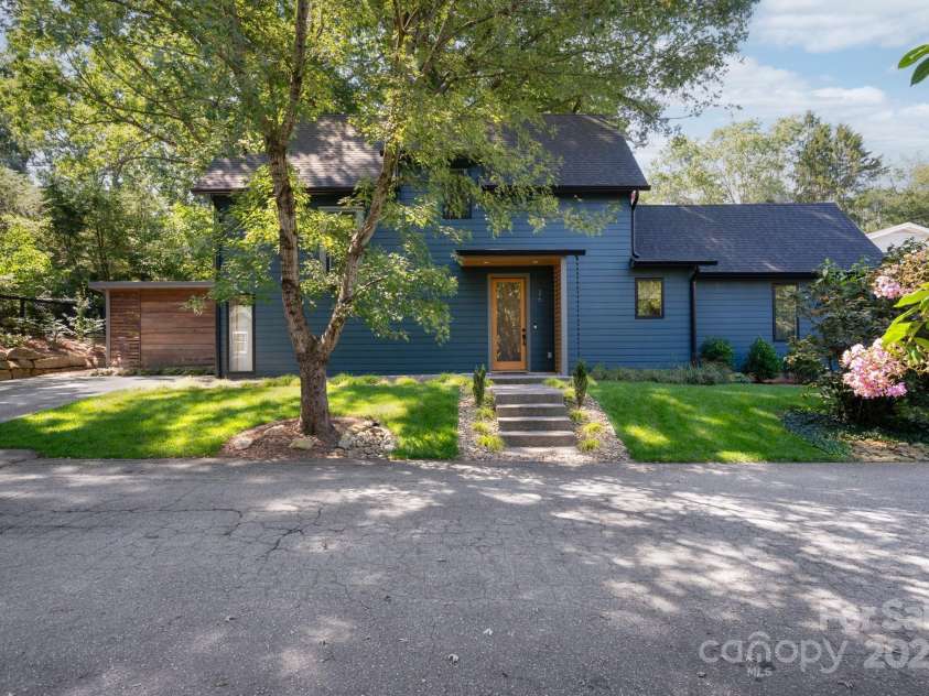 26 Winnfred Street, Asheville, NC 28806.  MLS# CAR4293290, YatesRealty ID 34446. Plant-Lined Exposed Aggregate Concrete Pavers Lead to Covered Front Porch