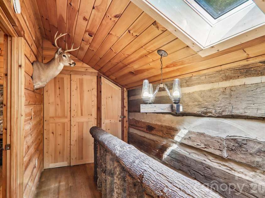 251 Village Lane, Mars Hill, NC 28754.  MLS# CAR4399231, YatesRealty ID 34447. Hallway Upstairs w/Skylight
