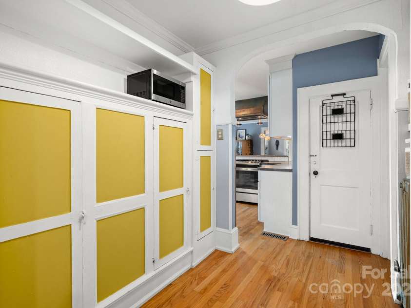 77 Mitchell Avenue, Asheville, NC 28806.  MLS# CAR4285971, YatesRealty ID 34450. Built in cabinet pantry storage and more.