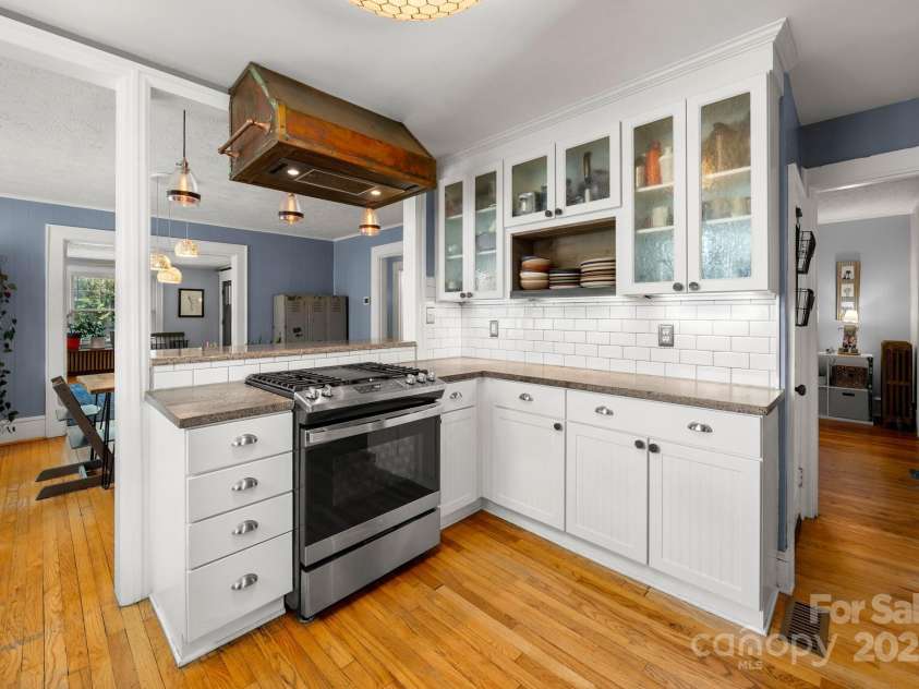 77 Mitchell Avenue, Asheville, NC 28806.  MLS# CAR4285971, YatesRealty ID 34450. Custom copper hood.