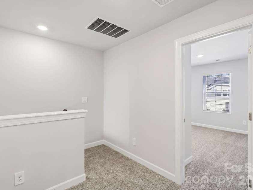 9012 Foggy Brook Loop, Charlotte, NC 28216.  MLS# CAR4399578, YatesRealty ID 34453. Photo is not of the actual home, but is an inspirational photo of builder’s model home and may depict options, furnishings, and/or decorator features that are not included