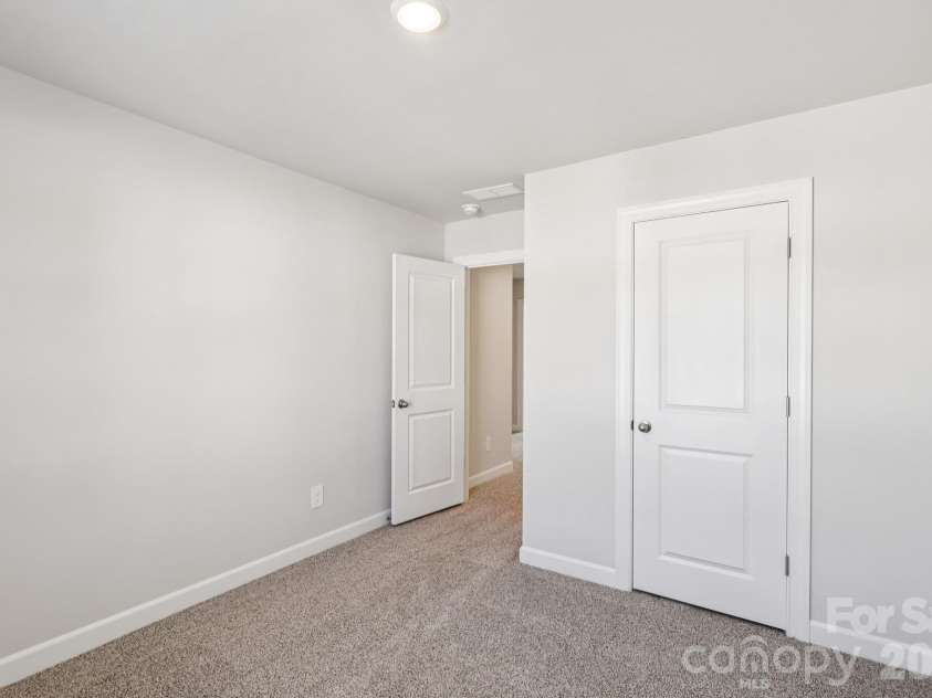9012 Foggy Brook Loop, Charlotte, NC 28216.  MLS# CAR4399578, YatesRealty ID 34453. Photo is not of the actual home, but is an inspirational photo of builder’s model home and may depict options, furnishings, and/or decorator features that are not included