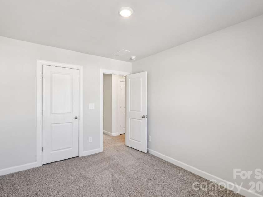 9012 Foggy Brook Loop, Charlotte, NC 28216.  MLS# CAR4399578, YatesRealty ID 34453. Photo is not of the actual home, but is an inspirational photo of builder’s model home and may depict options, furnishings, and/or decorator features that are not included
