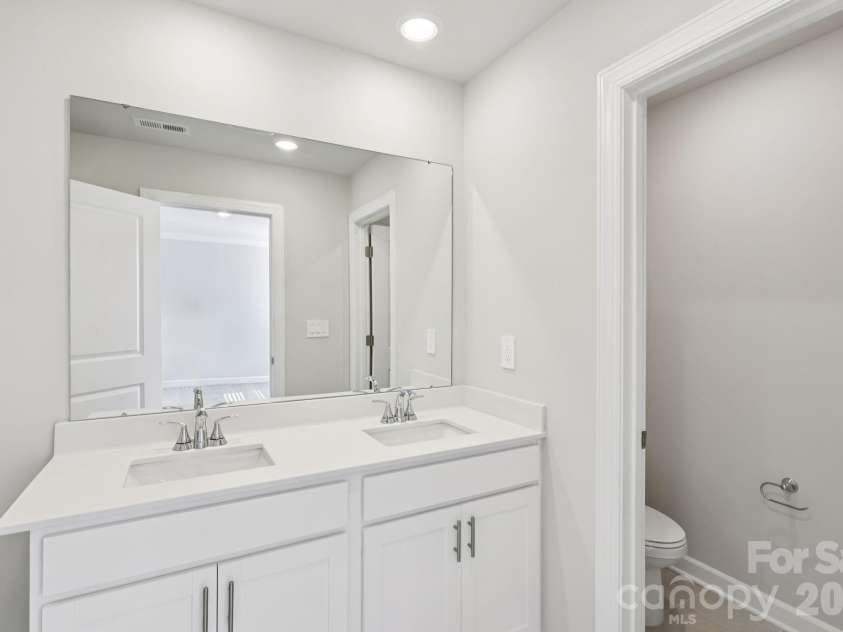 9012 Foggy Brook Loop, Charlotte, NC 28216.  MLS# CAR4399578, YatesRealty ID 34453. Photo is not of the actual home, but is an inspirational photo of builder’s model home and may depict options, furnishings, and/or decorator features that are not included