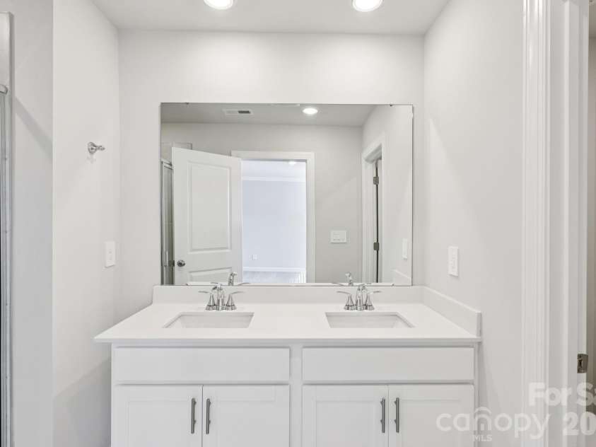 9012 Foggy Brook Loop, Charlotte, NC 28216.  MLS# CAR4399578, YatesRealty ID 34453. Photo is not of the actual home, but is an inspirational photo of builder’s model home and may depict options, furnishings, and/or decorator features that are not included