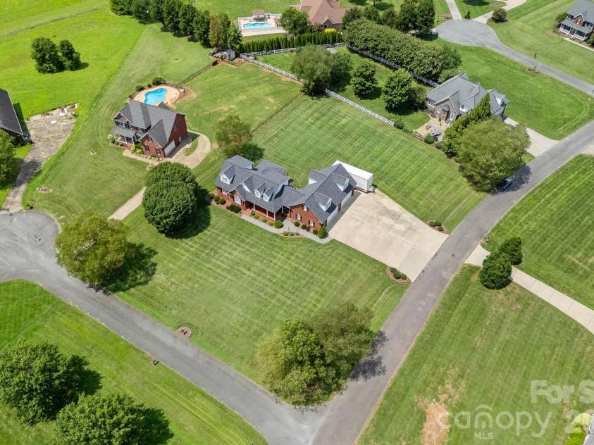 600 Ivah Lee Way, Monroe, NC 28110.  MLS# CAR4293198, YatesRealty ID 3446. FULL Brick w/ 4-car Garage on 1-acre Level lot!