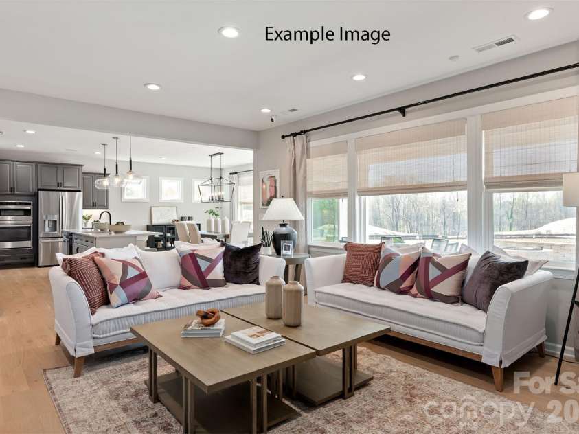 1713 Tabby Drive, Indian Trail, NC 28079.  MLS# CAR4367266, YatesRealty ID 34466. Example Photo - Family Room/Kitchen/Breakfast