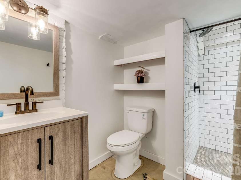 9 Houston Street, Asheville, NC 28801.  MLS# CAR4398917, YatesRealty ID 34469. Lower bathroom