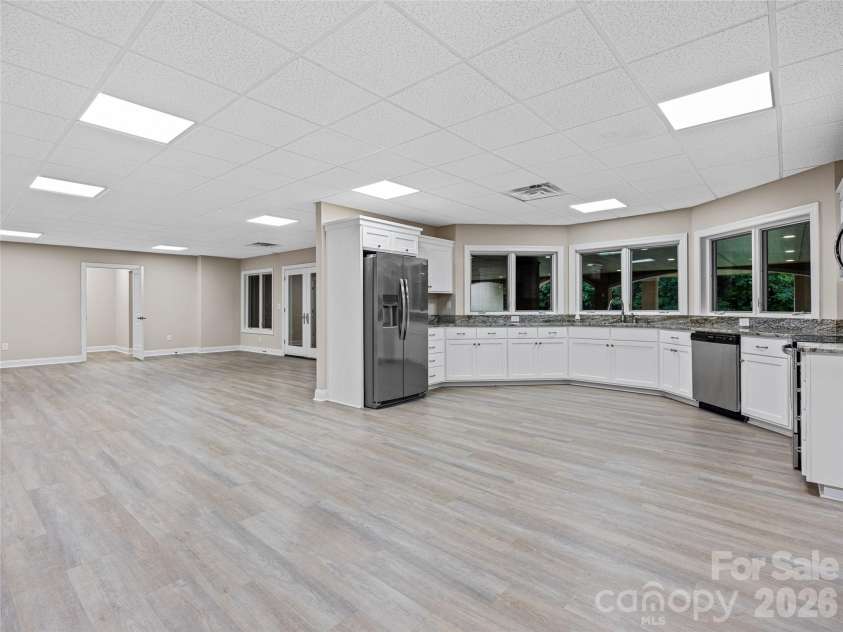 1090 Pearidge Road, Bostic, NC 28018.  MLS# CAR4283526, YatesRealty ID 3448. Lower level finished area includes second kitchen, multiple flex/bonus rooms, full bathroom and laundry area.