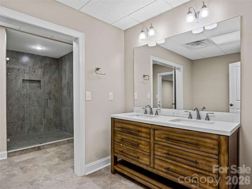 1090 Pearidge Road, Bostic, NC 28018.  MLS# CAR4283526, YatesRealty ID 3448. Lower level finished area includes second kitchen, multiple flex/bonus rooms, full bathroom and laundry area.