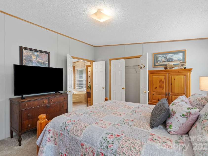 213 Old State Ten Road, Black Mountain, NC 28711.  MLS# CAR4294666, YatesRealty ID 34482. Double doors lead into the en-suite bathroom, creating a private retreat within the home.