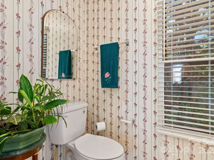 213 Old State Ten Road, Black Mountain, NC 28711.  MLS# CAR4294666, YatesRealty ID 34482. The en-suite bathroom includes a private water closet with its own window, offering both functionality and natural light