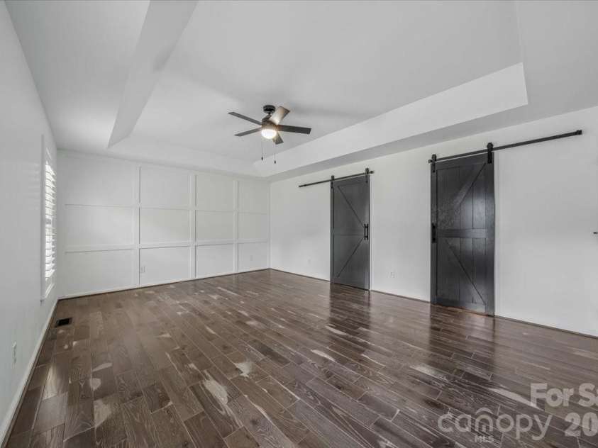 1512 Kinglet Drive, York, SC 29745.  MLS# CAR4393355, YatesRealty ID 34483. Barn doors in primary
