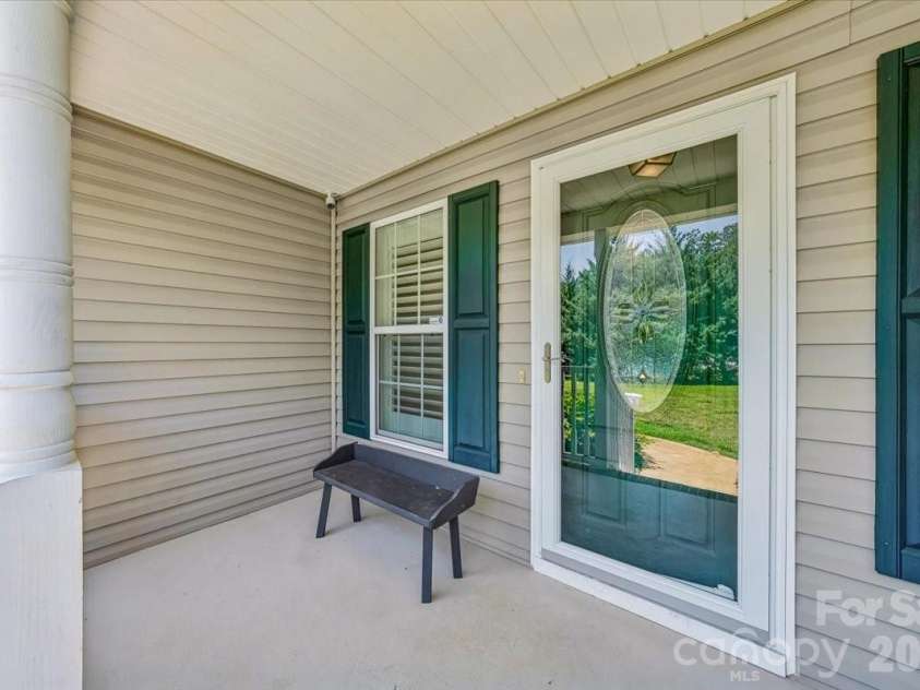 1512 Kinglet Drive, York, SC 29745.  MLS# CAR4393355, YatesRealty ID 34483. Rocking chair front porch