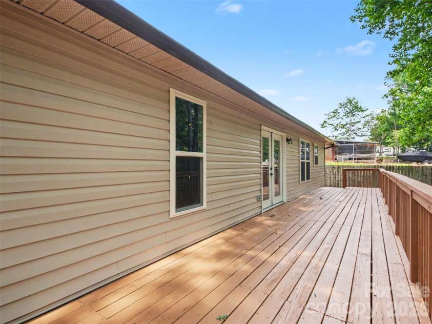 7382 Summit Drive, Denver, NC 28037.  MLS# CAR4391296, YatesRealty ID 34487. Back of home- deck
