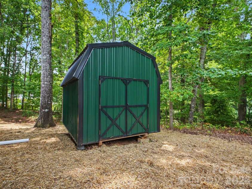 7382 Summit Drive, Denver, NC 28037.  MLS# CAR4391296, YatesRealty ID 34487. Shed in Backyard