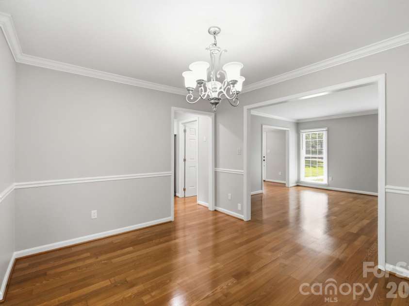 2106 Caleo Circle, Charlotte, NC 28270.  MLS# CAR4397014, YatesRealty ID 34488. Dining room flows into family room