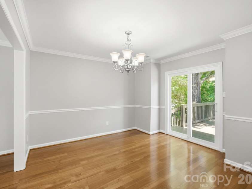 2106 Caleo Circle, Charlotte, NC 28270.  MLS# CAR4397014, YatesRealty ID 34488. Dining room with sliding door to back deck