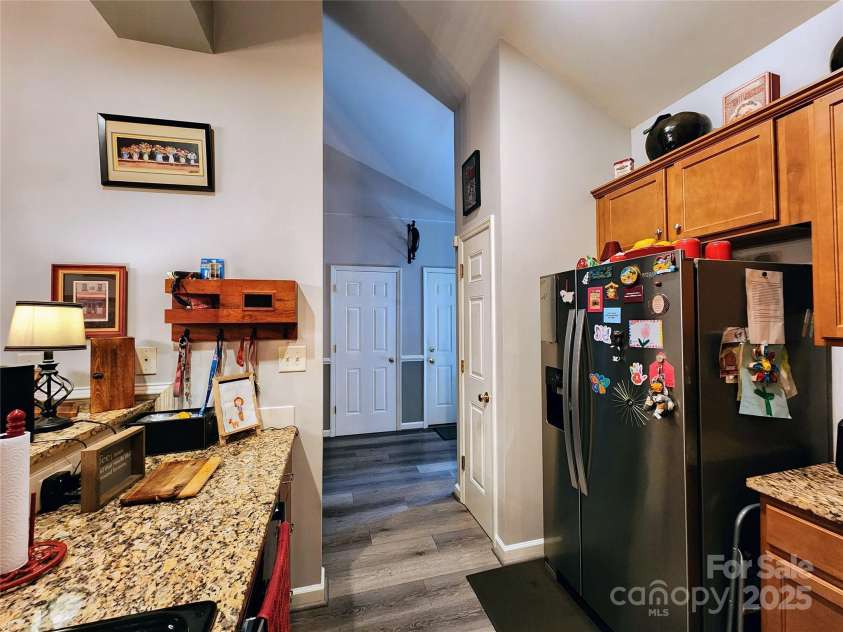 100 Wentworth Drive, Mocksville, NC 27028.  MLS# CAR4296498, YatesRealty ID 34495. Kitchen view to foyer