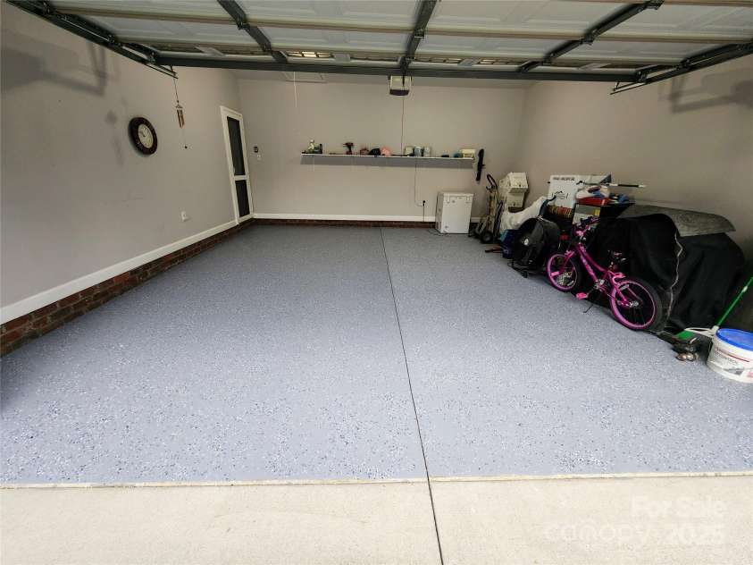 100 Wentworth Drive, Mocksville, NC 27028.  MLS# CAR4296498, YatesRealty ID 34495. Newly epoxy painted garage floor