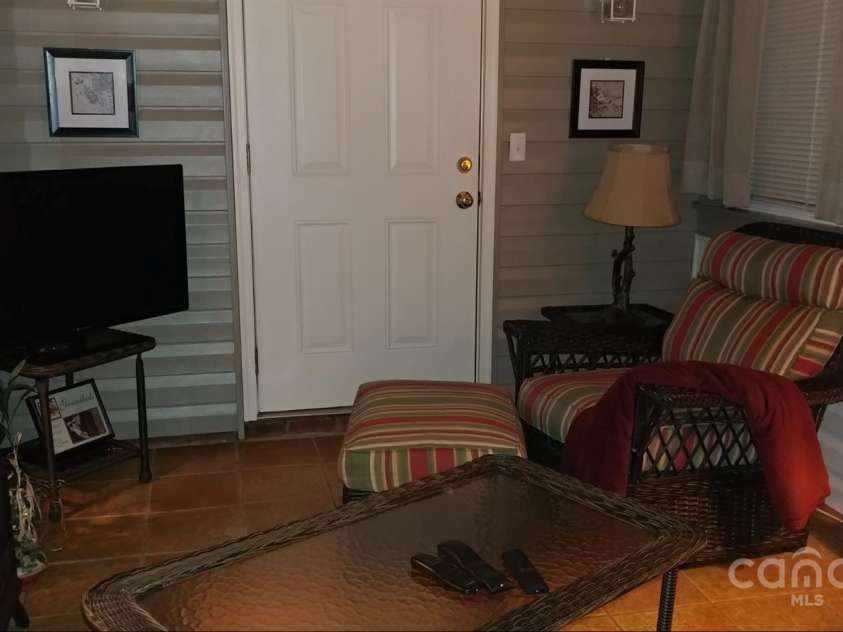 100 Wentworth Drive, Mocksville, NC 27028.  MLS# CAR4296498, YatesRealty ID 34495. Previous photo of sunroom prior to being used as a bedroom