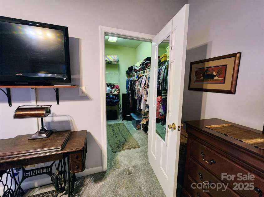 100 Wentworth Drive, Mocksville, NC 27028.  MLS# CAR4296498, YatesRealty ID 34495. Primary bedroom walk-in closet