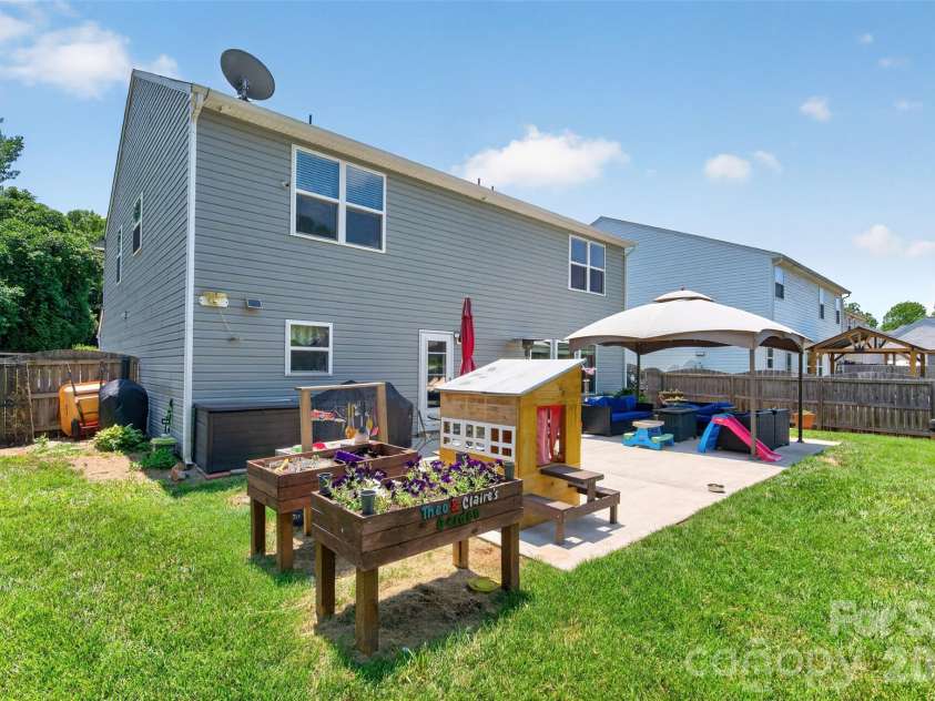 1200 Catawba Run, Lowell, NC 28098.  MLS# CAR4392613, YatesRealty ID 34515. Back Yard